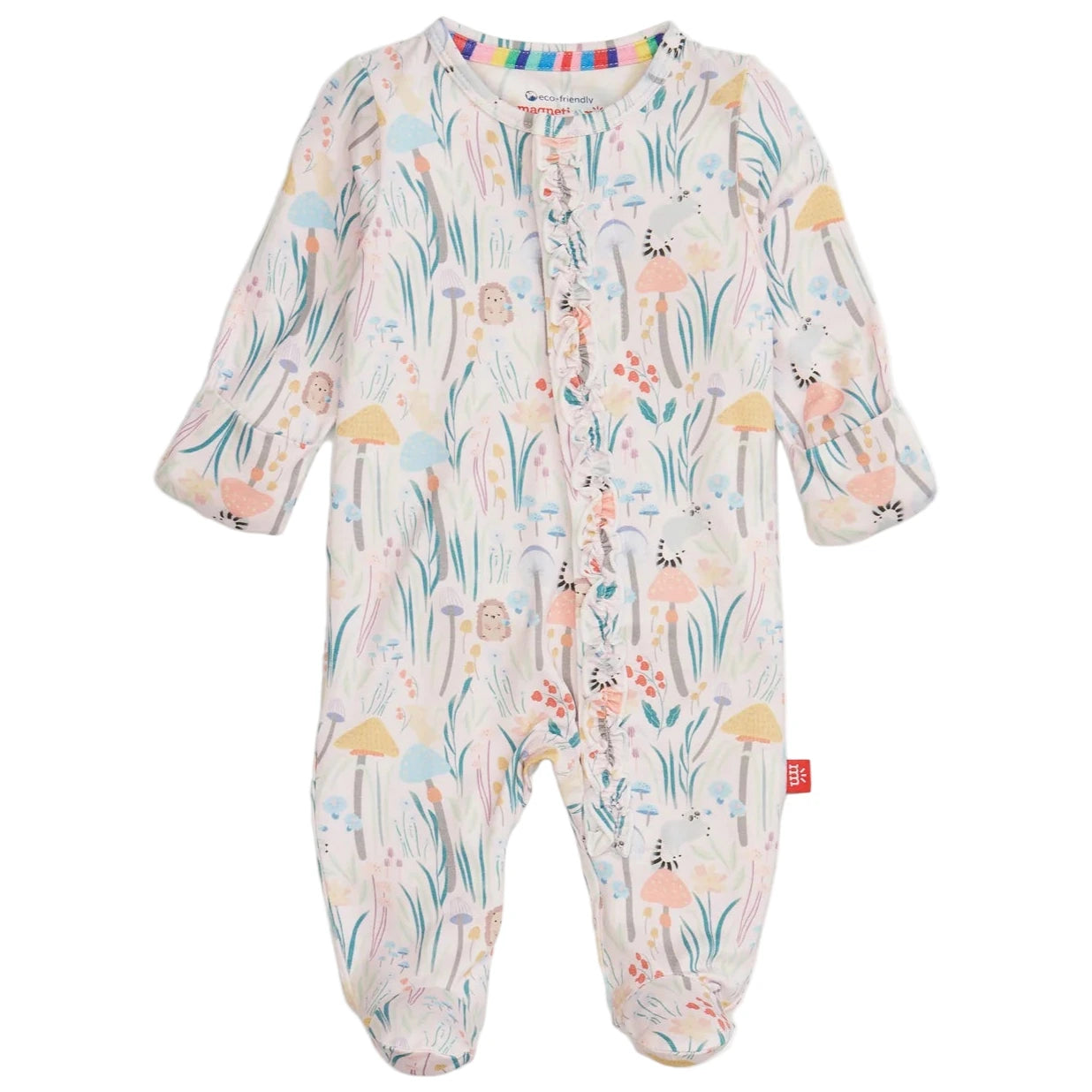 The Magnetic Me Baby Girls' Shroom and Bloom with Ruffle Modal Magnetic Footie features sustainable modal, a colorful floral and woodland print, magnetic front closures, enclosed feet, and cozy ruffle details.