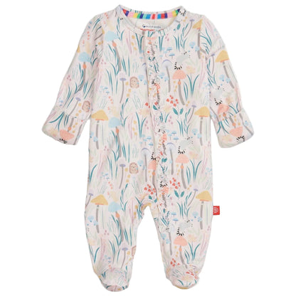 The Magnetic Me Baby Girls' Shroom and Bloom with Ruffle Modal Magnetic Footie features sustainable modal, a colorful floral and woodland print, magnetic front closures, enclosed feet, and cozy ruffle details.