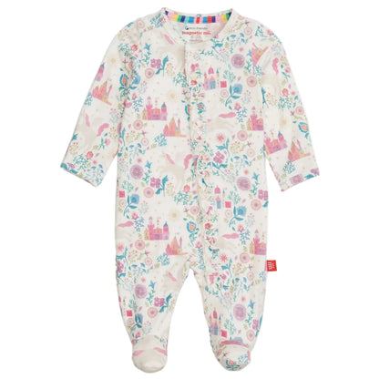The Magnetic Me Baby Girls' Tail of Magic with Ruffle Modal Magnetic Footie features long sleeves, covered feet, colorful castles, unicorns, flowers, and easy magnetic closures for quick changes.