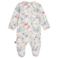 The Magnetic Me Baby Girls' Tail of Magic with Ruffle Modal Magnetic Footie features a fairy tale castle and floral print on white, long sleeves, and easy magnetic closures for quick diaper changes.