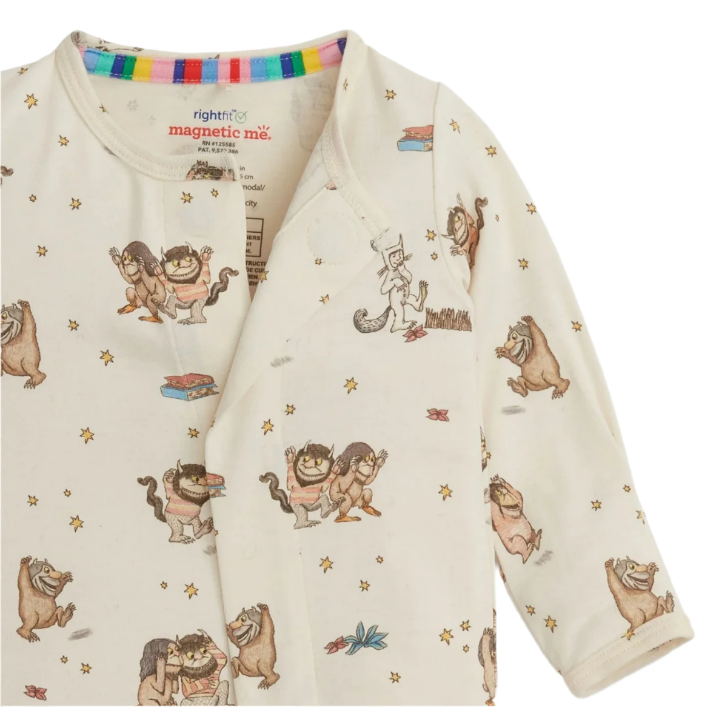 The Magnetic Me Baby 'Where the Wild Things Are' Footie features playful character prints and a cream color, made from naturally flame-retardant RightFit fabric with a rainbow-striped trim inside the collar.