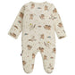 The Magnetic Me "Baby' Where the Wild Things Are Footie" is a cream-colored, loose-fitting baby onesie with long sleeves and footed legs, featuring character illustrations and stars, made from naturally flame retardant RightFit fabric.