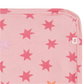 A close-up of the Cosmic Confetti Baby Blanket by Magnetic Me, featuring pink modal fabric with colorful stars, neat stitching, and a white tag with a red crown—an ideal soft stroller blanket.