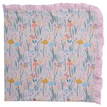 The Shroom and Bloom Modal Blanket with Ruffles by Magnetic Me features a whimsical mushroom and flower print. Made with breathable modal, it’s perfect as a stroller blanket and keeps your baby cozy all year round.