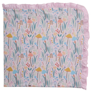 The Shroom and Bloom Modal Blanket with Ruffles by Magnetic Me features a whimsical mushroom and flower print. Made with breathable modal, it’s perfect as a stroller blanket and keeps your baby cozy all year round.