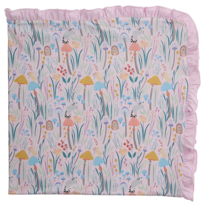 The Shroom and Bloom Modal Blanket with Ruffles by Magnetic Me features a whimsical mushroom and flower print. Made with breathable modal, it’s perfect as a stroller blanket and keeps your baby cozy all year round.