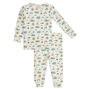The Magnetic Me Baby Boys' and Boys' Dumps Like A Truck Modal PJ Set features a white background with colorful vehicles print and includes long-sleeve top and matching pants, made from soft modal for all-night comfort.