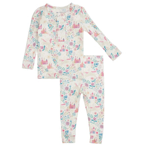 The Magnetic Me Baby Girls' and Girls' Tail of Magic Modal Magnetic PJ Set features soft modal fabric, a pastel fairy tale castle and floral print, a buttoned neckline, and matching pants.
