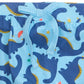 Close-up of Magnetic Me’s Baby Boys' Necks Generation Modal Long Sleeve Henley + Pant Set in soft modal, with blue pants featuring a light blue drawstring and a dark blue dinosaur pattern with yellow and colorful accents.