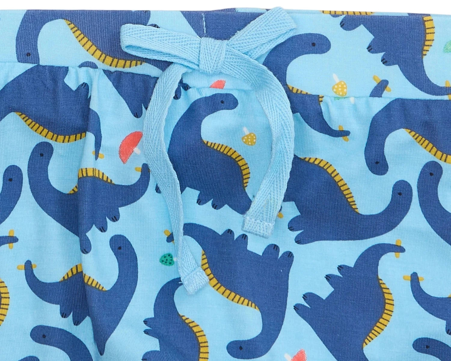 Close-up of Magnetic Me’s Baby Boys' Necks Generation Modal Long Sleeve Henley + Pant Set in soft modal, with blue pants featuring a light blue drawstring and a dark blue dinosaur pattern with yellow and colorful accents.
