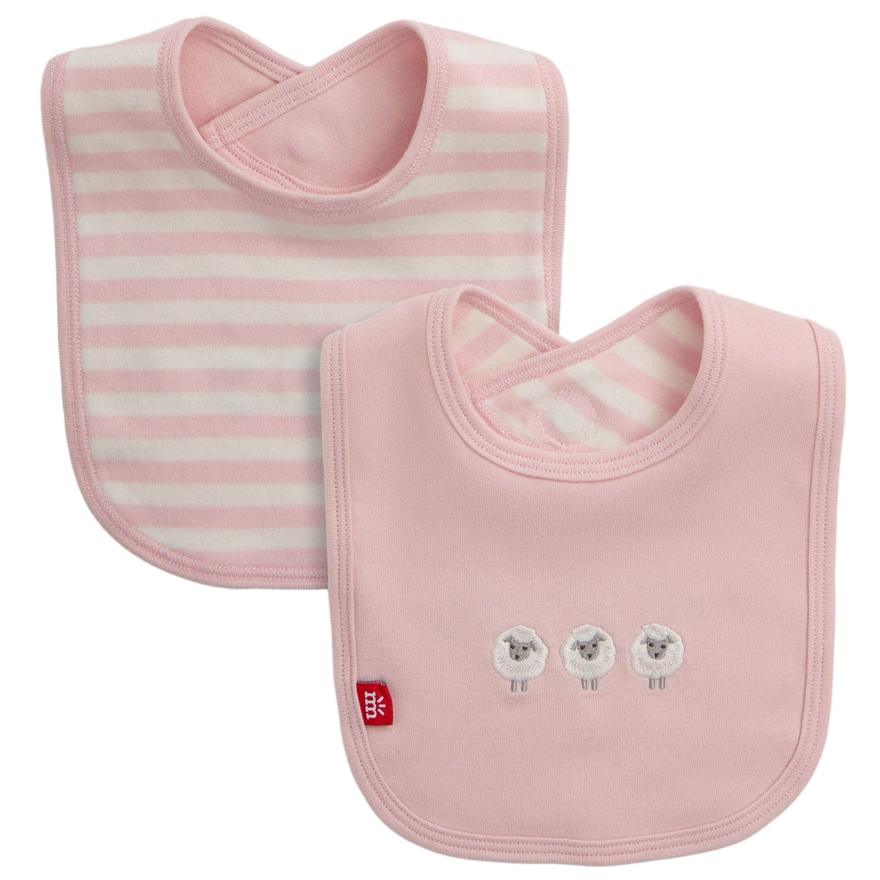 The Magnetic Me Stripe Organic Cotton Bib with Emb. set includes two pink organic cotton bibs: one with white stripes and one featuring three embroidered sheep. Both have a rounded shape and a cross-back neck closure.