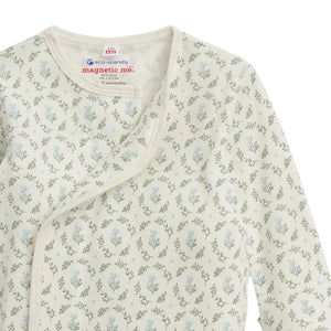 A close-up of the Baby Girls' Eloise Organic Cotton Magnetic Gown & Hat Set by Magnetic Me, featuring a light floral print, magnetic snap closure, and eco-friendly GOTS-certified fabric.