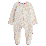 The Magnetic Me Baby Girls' Oinklet Model Footie features a charming floral print, convenient front magnetic closures for easy changes, and pink trim on the cuffs, collar, and feet. It is displayed on a white background.