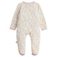 The Magnetic Me Baby Girls' Oinklet Model Footie features long sleeves, enclosed feet, and a pastel floral print with pink trim at the neckline and cuffs. Designed for convenience, it offers easy magnetic closures for quick changes. The footie is displayed on a white background.