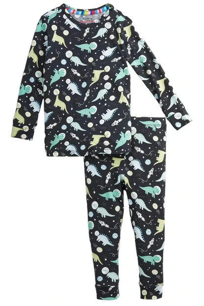 The Baby Boys’ and Boys’ Astroceratops Modal Long Sleeve Pajama Set by Magnetic Me features a black base with vibrant dinosaur and planet prints in green, blue, and yellow.