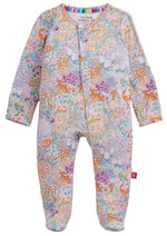 The Baby Girls’ Arabella Modal Footie by Magnetic Me features long sleeves, a vibrant floral and geometric print, and magnetic closures, shown flat on a white background.