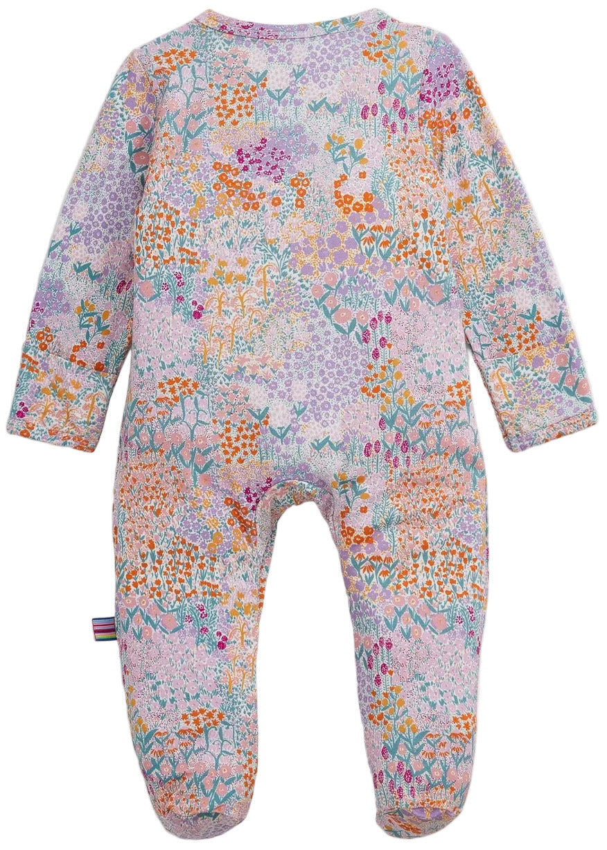 Baby Girls’ Arabella Modal Footie by Magnetic Me, featuring long sleeves and a colorful floral print, shown flat on a white background.