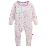 The Magnetic Me Baby Girls’ Bake Boss Modal Convertible Coverall is a long-sleeve onesie featuring a pastel food and drink pattern with bottles, cartons, and snacks on a light background, crafted from ultra-soft modal fabric for gentle comfort on delicate skin.