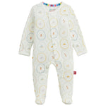 Magnetic Me Baby Nursery Magic Cream Modal Footie features long sleeves, a charming cream design with pastel animal and toy prints, full-length legs, and easy magnetic closures down the front. Made from sustainable modal for exceptional softness and comfort.