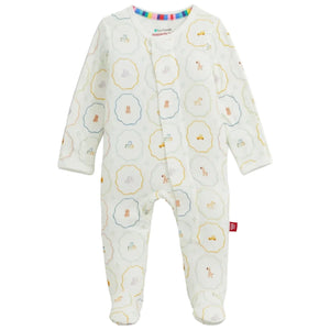 Magnetic Me Baby Nursery Magic Cream Modal Footie features long sleeves, a charming cream design with pastel animal and toy prints, full-length legs, and easy magnetic closures down the front. Made from sustainable modal for exceptional softness and comfort.