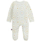 The Baby Nursery Magic Cream Modal Footie by Magnetic Me is a white long-sleeve baby onesie with feet, adorned with pastel animal and toy illustrations inside scalloped circles. Made from sustainable modal for exceptional softness, this footie features easy magnetic closures for quick and hassle-free changes.