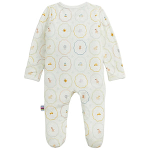 The Baby Nursery Magic Cream Modal Footie by Magnetic Me is a white long-sleeve baby onesie with feet, adorned with pastel animal and toy illustrations inside scalloped circles. Made from sustainable modal for exceptional softness, this footie features easy magnetic closures for quick and hassle-free changes.