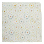 Wrap your little one in the Nursery Magic Modal Baby Blanket from Magnetic Me, featuring a soft white background adorned with a repeating pattern of scalloped circles—each filled with charming illustrations like bears, cars, hot air balloons, and suitcases in soothing pastel hues. Perfect for cuddling at home or as a cozy stroller blanket.