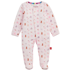 Baby Nursery Nostalgia Modal Footie by Magnetic Me is a pink baby sleeper featuring long sleeves, a footed design, and a playful animal print. Made from soft, sustainable modal fabric, this footie includes convenient magnetic closures for easy dressing. The garment is shown laid flat against a white background.