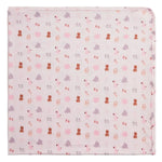 The Magnetic Me Nursery Nostalgia Modal Blanket features a light pink design adorned with a playful, repeating pattern of teddy bears, sheep, and rattles in shades of brown, gray, and pink. This temperature-regulating stroller blanket is neatly folded to showcase its softly rounded edges.
