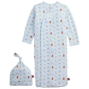 The Magnetic Me Baby Nursery Nostalgia Modal Gown + Hat Set includes a light blue sleep sack with a matching knot hat, both adorned with a charming pattern of small bears, sheep, and stars. This cozy newborn gown features long sleeves and a side zipper for easy changes.