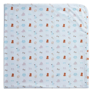 The Magnetic Me Nursery Nostalgia Modal Blanket in light blue showcases a charming repeated pattern of brown bears, blue elephants, ducks, rattles, and baby shoes. Crafted from temperature-regulating modal fabric, this blanket is perfect as a stroller accessory to keep your little one cozy and comfortable in every season.