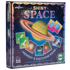 The Eeboo Space Shiny Memory & Matching Game includes 24 space-themed matching pairs with a planet and vibrant science designs; for ages 5+.
