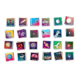 The Eeboo Space Shiny Memory & Matching Game features 25 square tiles with Uta Krogmann’s colorful illustrations and labels of planets, spacecraft, and space phenomena, perfect for a fun memory game.