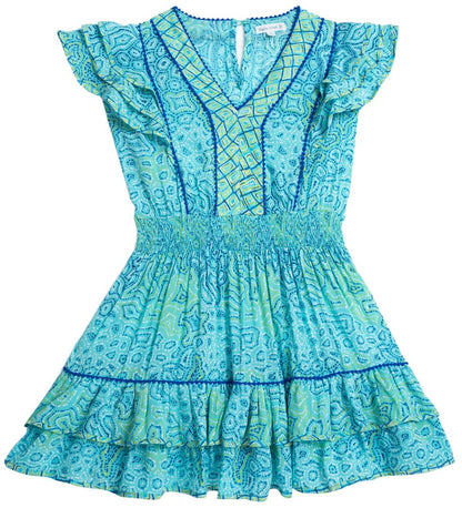 A Poupette St Barth Girls' Camila Mini Dress in light teal with blue and green geometric patterns, featuring butterfly sleeves, a V-neckline, and a flounced hem.