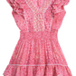 A Poupette St Barth Girls' Camila Mini Dress by Poupette St Barth with butterfly sleeves and a smocked waist, featuring a tiered, ruffled hem and a geometric design on the bodice.