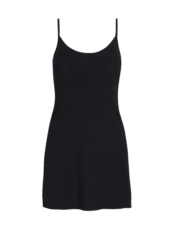 The Commando Classic Mini Cami Slip is a plain black dress with spaghetti straps and a weighted hem, shown on a white background—ideal for layering under dresses.