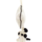 A white plush toy resembling a panda hangs by an ivory loop attached to a matching plush object with a single black stripe, perfect for a newborn. The soft cream fur is reminiscent of the Jellycat Bashful Black & Cream Puppy Musical Pull, adding an extra touch of cuddliness.