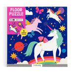 A vibrant puzzle box showcasing rainbow unicorns, butterflies, and stars against a dark blue background. The label reads “Unicorn Magic Floor Puzzle, 25+, 6 shaped oversized pieces,” by Chronicle Books.
