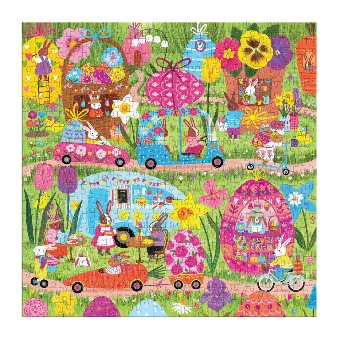 Delight bunny puzzle enthusiasts with the Family Hoppin’ Around Puzzle by Chronicle Books—a colorful, illustrated 500-piece family puzzle by Jenny Miriam. Featuring charming rabbits in vehicles and homes shaped like Easter eggs and flowers, surrounded by lush grass and bright spring blooms with various seasonal activities, it’s perfect for your next family game night.