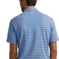 A man is shown from the back wearing a blue and white striped Peter Millar Atrium Performance Jersey Polo with Summer Comfort, paired with light gray pants.