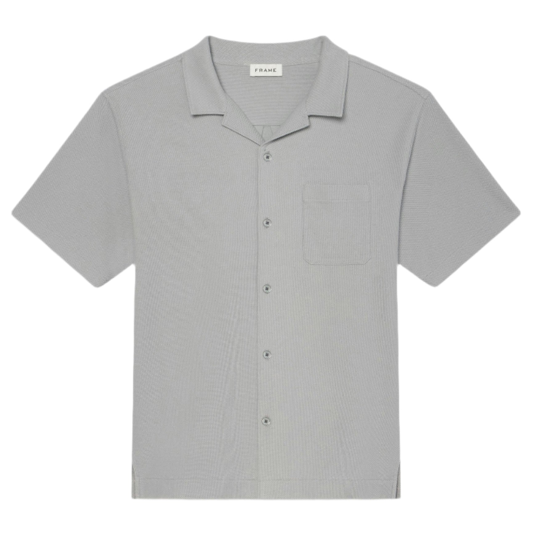 The Frame Jacquard Short Sleeve Relaxed Shirt in light gray features textured cotton, a notched collar, single chest pocket, and is displayed flat on a white background.