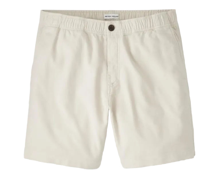 The Peter Millar Crown Weekend Short is a beige, knee-length stretch-cotton short with an elastic waist, button closure, and side pockets, shown on a white background.