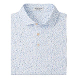 The Peter Millar Nice Shot Performance Jersey Polo is a folded, button-up shirt with a light blue and white floral pattern, featuring UPF 50+ protection.