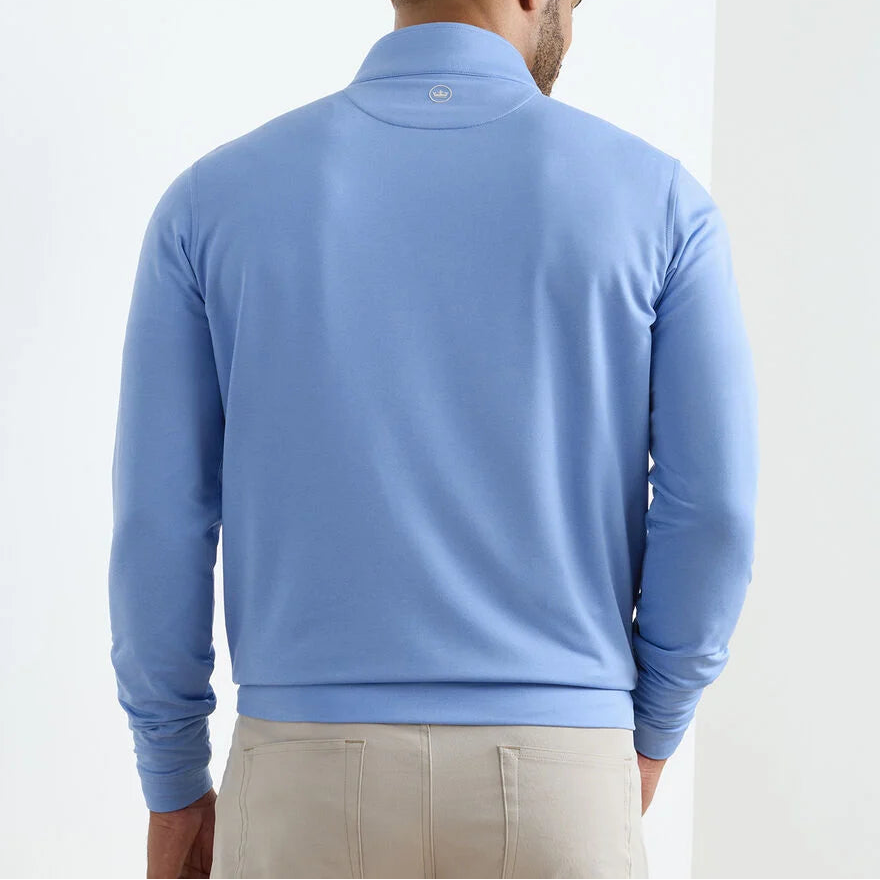 A man is shown from the back against a plain white background, wearing beige pants and a light blue Peter Millar Perth Mélange Performance Quarter-Zip pullover.