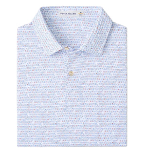 A folded “Featherweight Cornhole Performance Polo” by Peter Millar features a collared, two-button design with subtle multicolored geometric print, four-way stretch, and UPF 50+ sun protection.