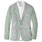 The Weekend Soft Jacket by Peter Millar is a light green, garment-dyed unstructured blazer with notch lapels, two brown buttons, and patch pockets, paired with a white dress shirt.
