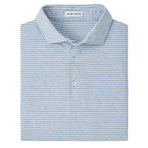A folded Calvert Crown Flex Cotton Polo by Peter Millar in light blue and white stripes, featuring a collar, two buttons, and the brand label inside—ideal for polished casual style.