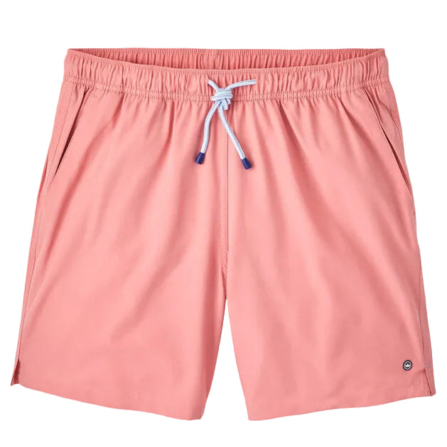 The Peter Millar Crown Swim Trunk features light pink fabric, a light blue drawstring on an elastic waistband, side pockets, and a mesh liner for comfort. Displayed against a white background.