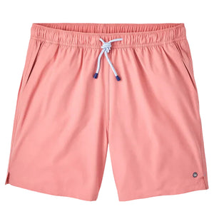The Peter Millar Crown Swim Trunk features light pink fabric, a light blue drawstring on an elastic waistband, side pockets, and a mesh liner for comfort. Displayed against a white background.