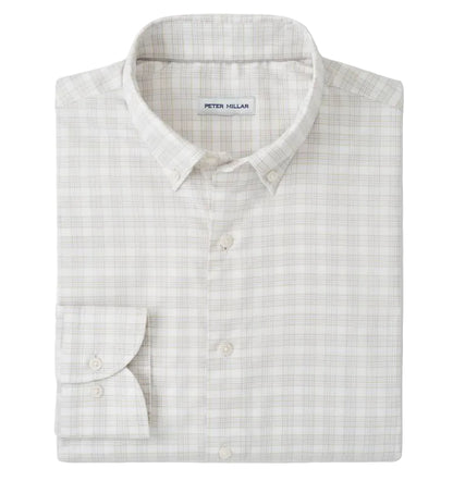 The Peter Millar Douglas Crown Lite Cotton-Stretch Sport Shirt is a light plaid, long-sleeve twill button-up, neatly folded with the "Peter Millar" label visible, crafted from easy-care stretch cotton for comfort and style.